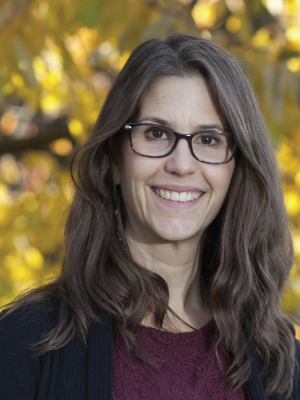 Kimberly Phillips is a woman with long brown hair and glasses